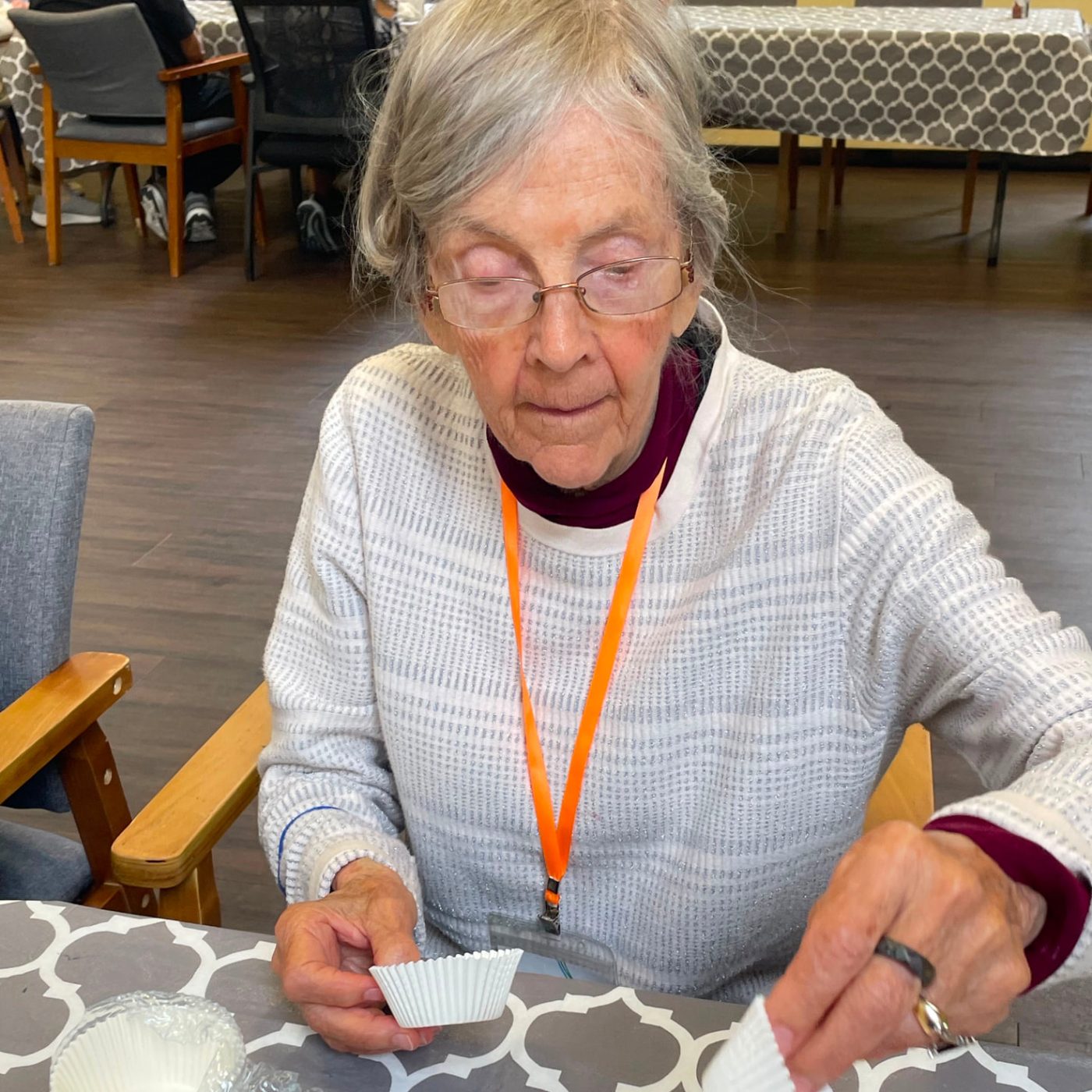 An Evergreen member setting out liners for a morning baking class