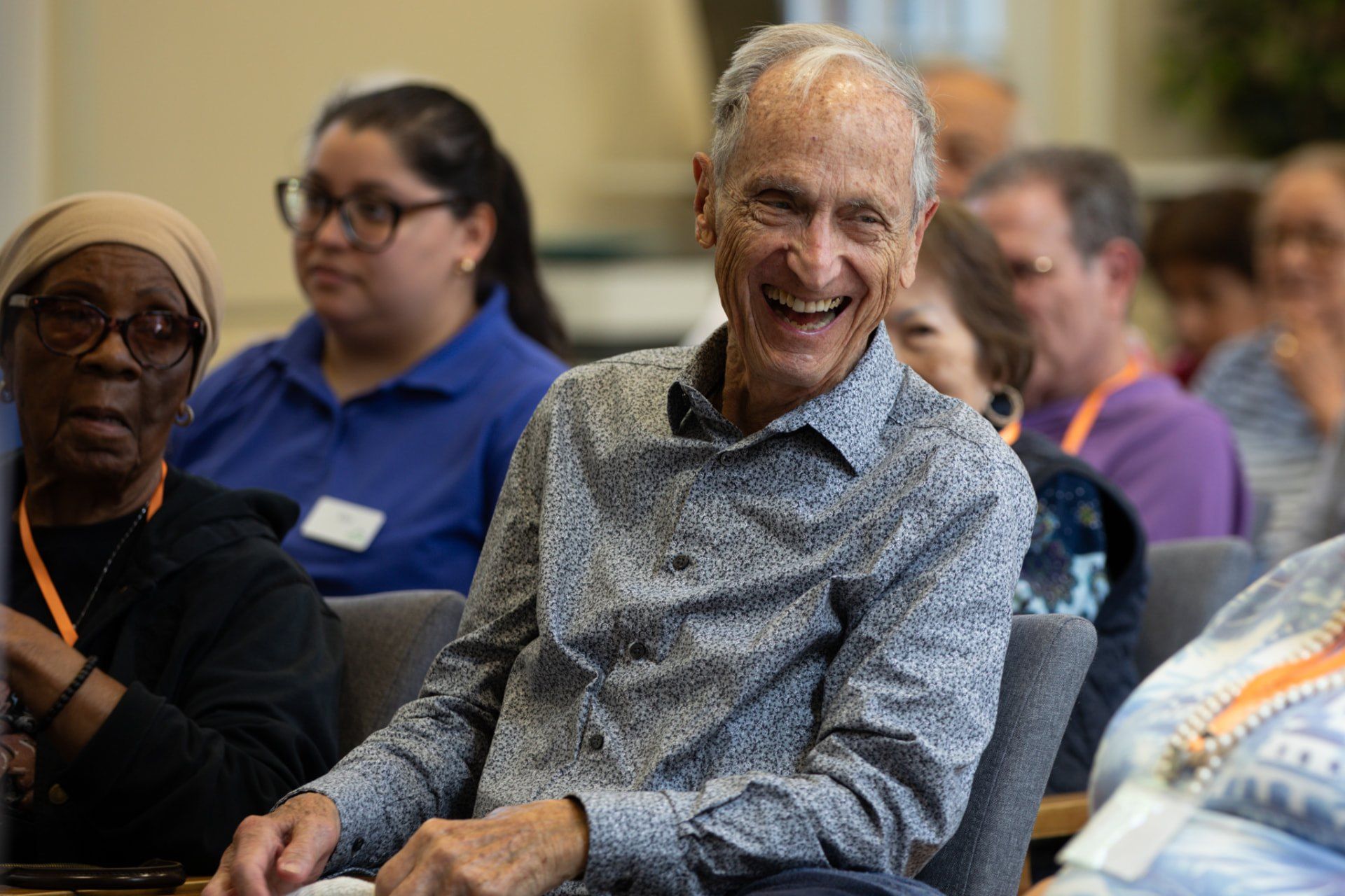 Members and staff together at Evergreen mid-day, sharing a laugh in natural light